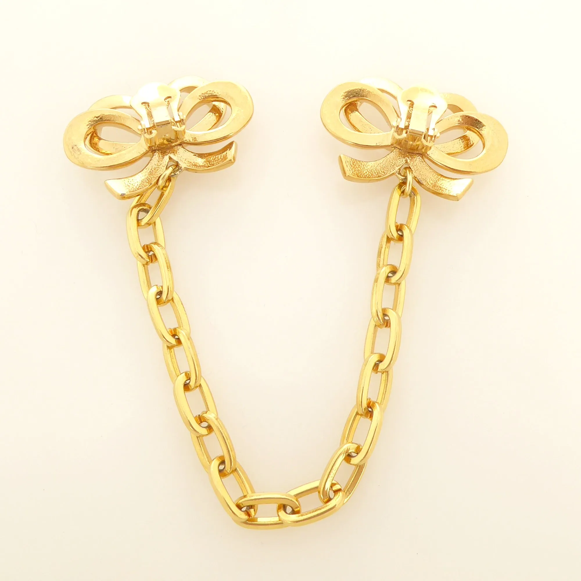 Gold bow collar clips