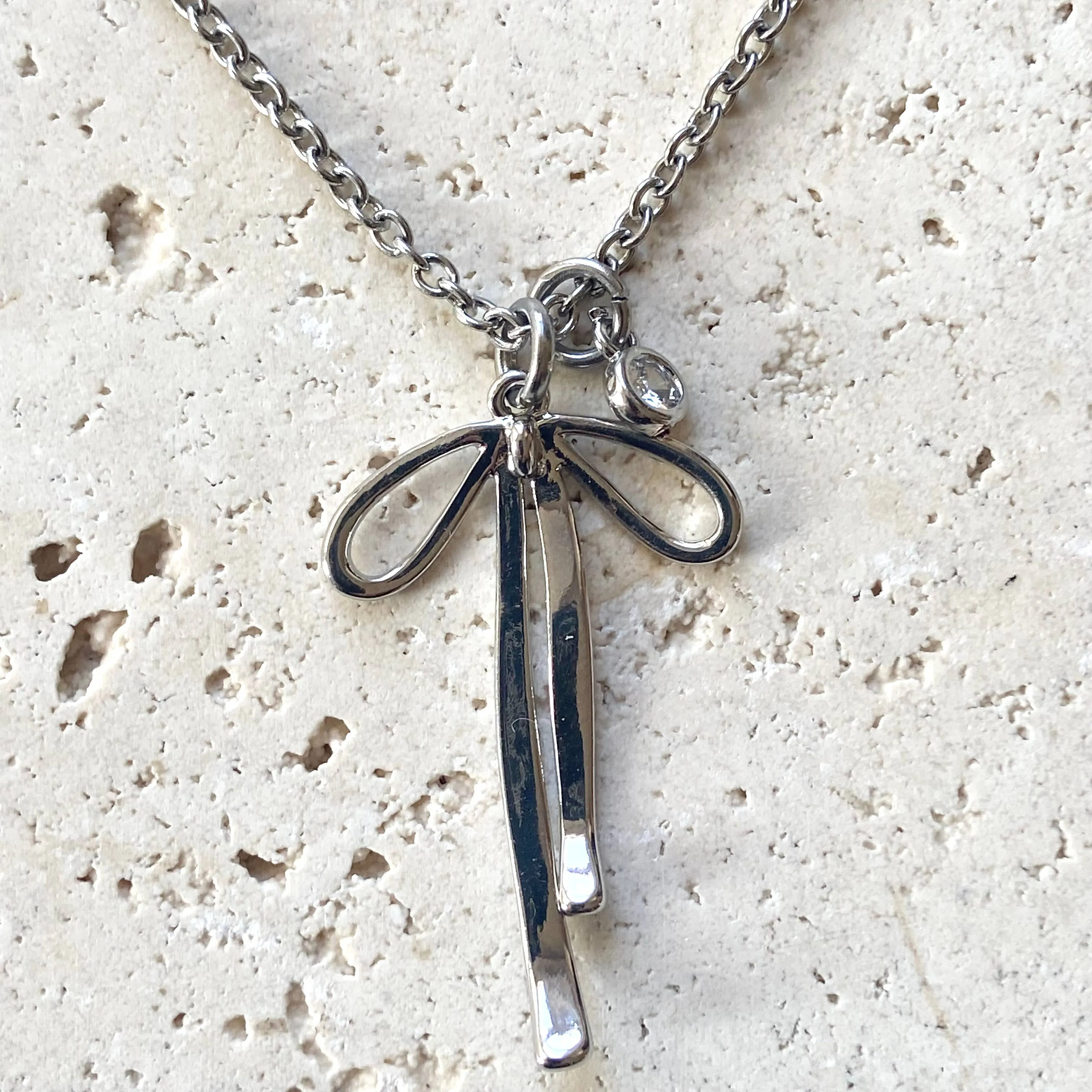 Melted ribbon bow charm necklace: silver